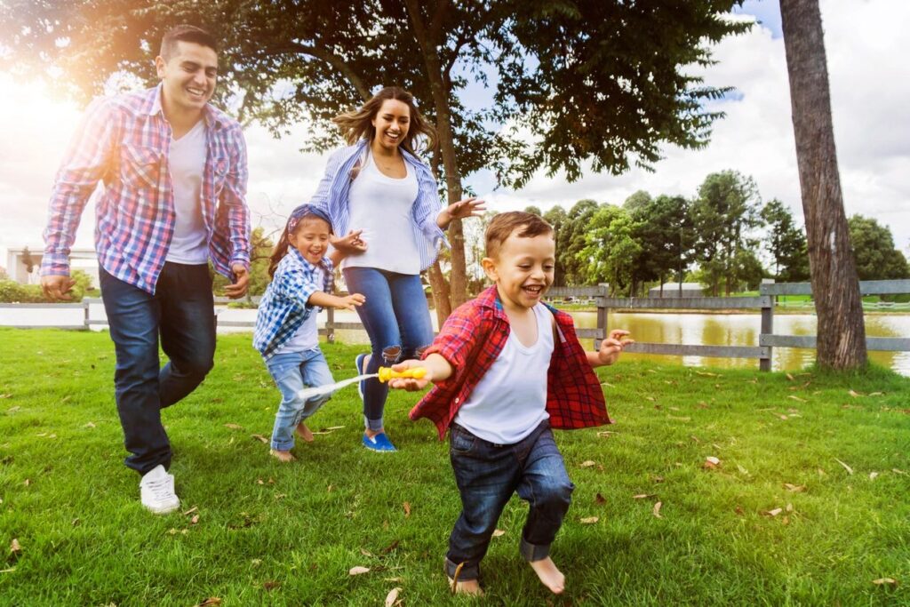 image of family running in the backyard