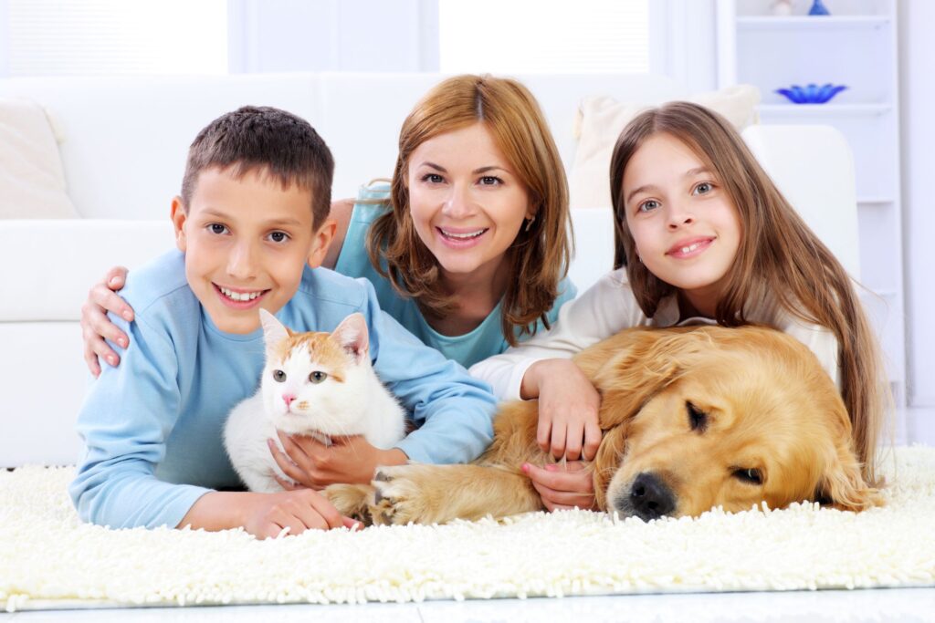image of family with pets