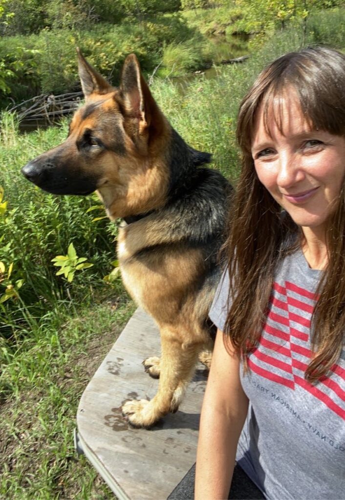 Image of German Shepherd and woman