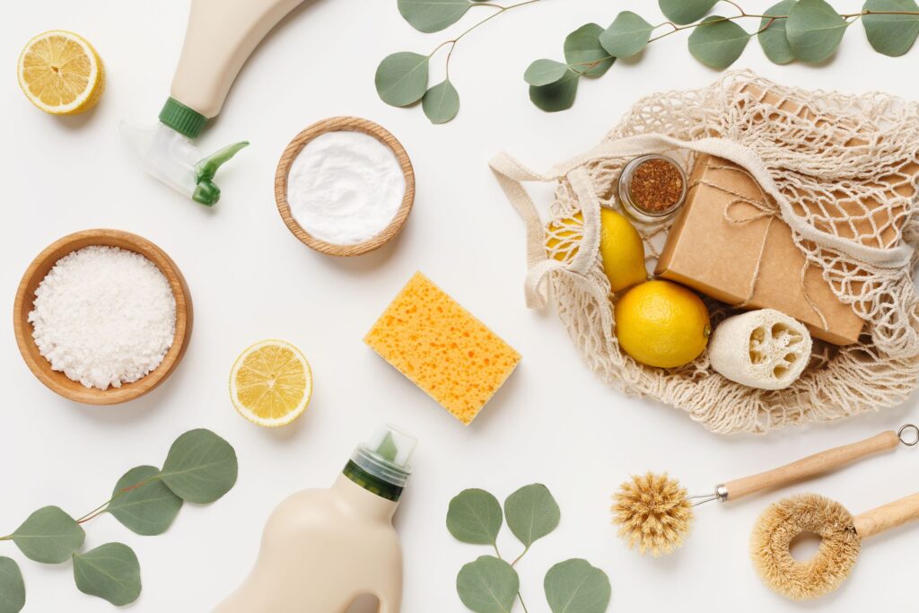 image of natural cleaners with vines, lemons, and a powder