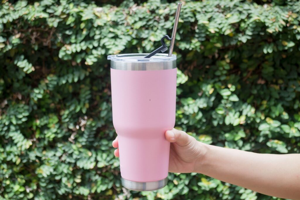 image of a pink reusable cup with a metal straw