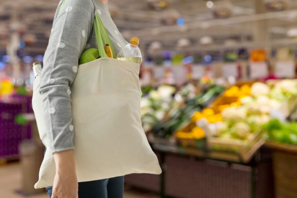 image of a woman shopping with a reusable bag