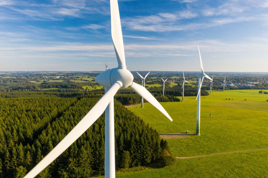 an image of a countryside dotted with windmills